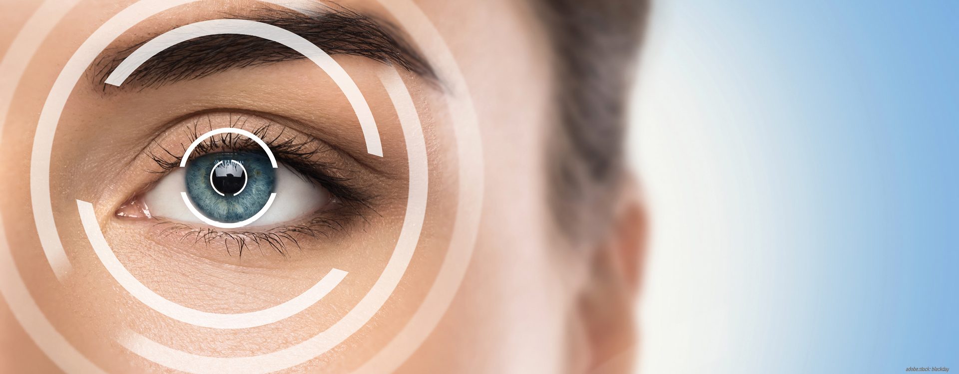 menschliches Auge mit stilisierten Kreisen um die Pupille